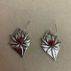 pretty silver plate Earrings With a red stone in the middle, hanging hoop